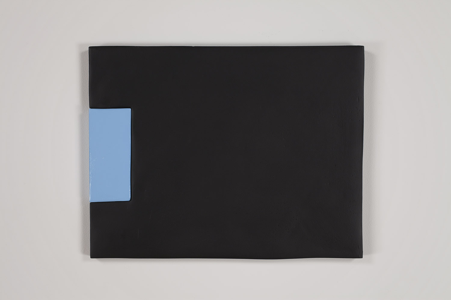 Sadie Benning, *Wipe, Rust-oleum Flat Black and Rust-oleum Hi Gloss Harbor Blue*, 2011. Medite 2, spray paint, dowels, and plaster, 14 x 18 inches