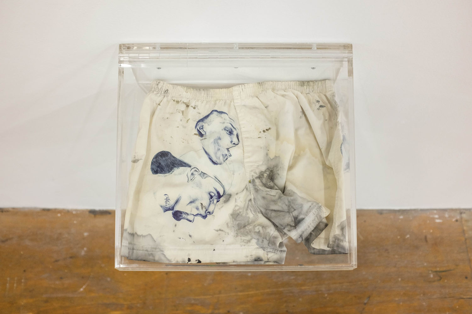 Rafa Esparza, *paños puñales. you can see it in their faces. uno (faggot handkerchiefs... one)*, 2011. Blue ball point pen, blood, urine, saliva, black ink on white waist boxer