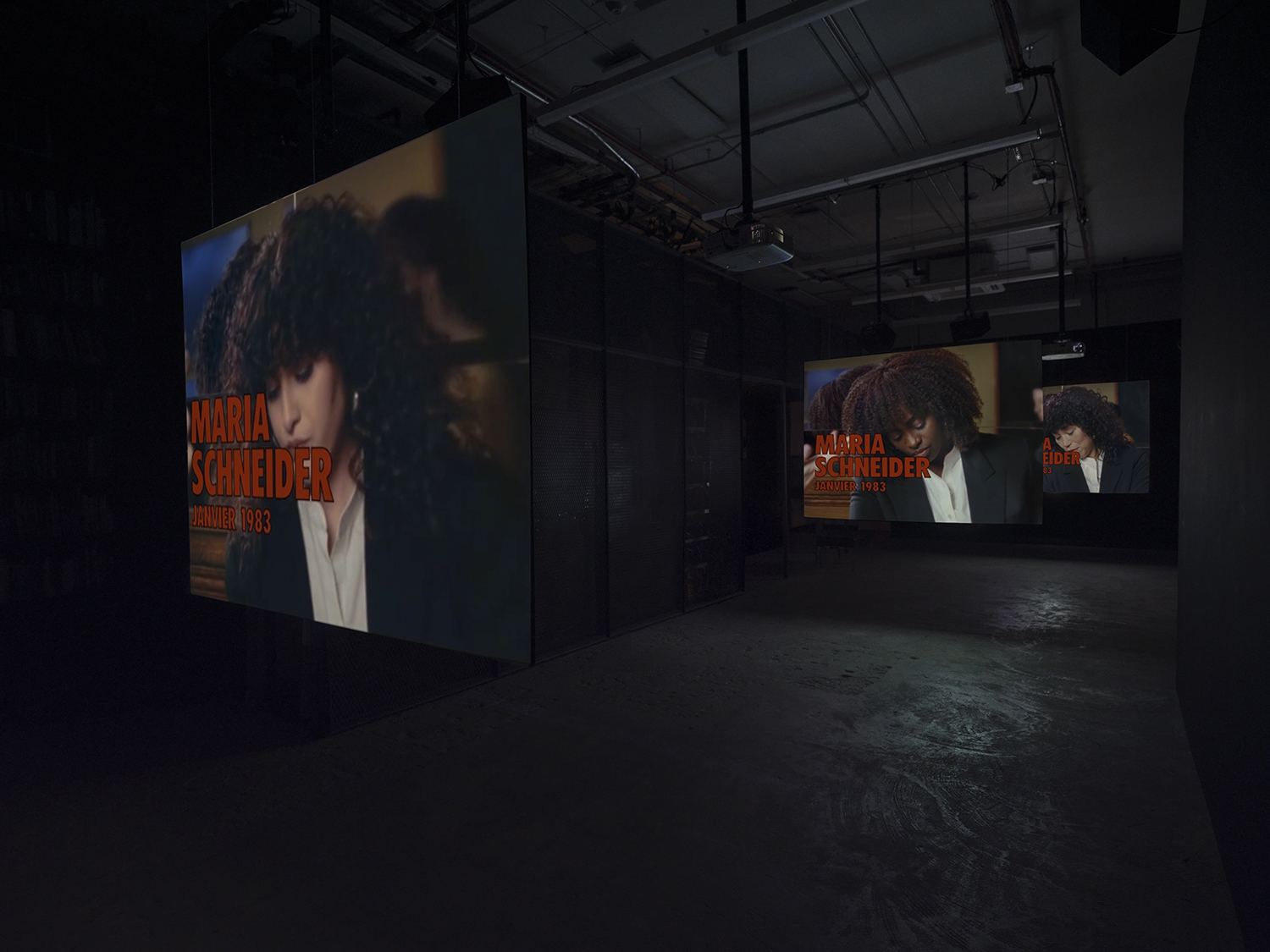 Elisabeth Subrin, *The Listening Takes / Manal Issa, 2024*, 2024, installation view; pictured *The Listening Takes*, 2023-2024, <br>30:00 minutes, 3-channel 16mm/HD video, 9-channel sound, speakers, suspended screens, Photo: Daniel Kukla