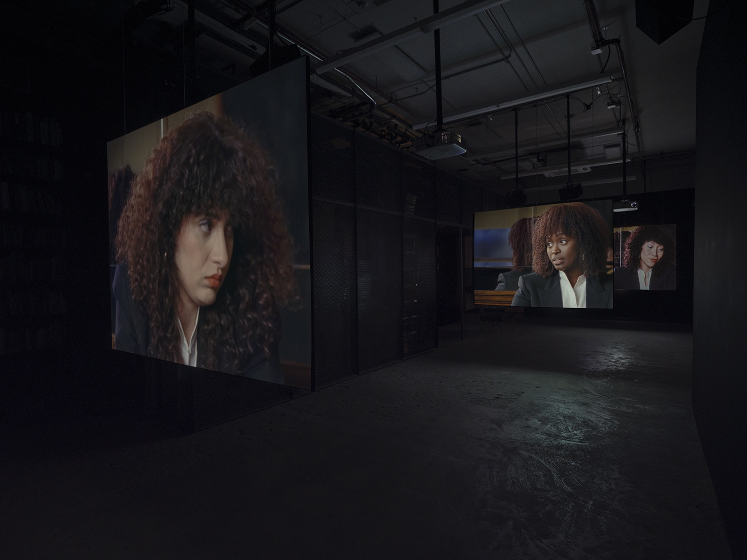 Elisabeth Subrin, *The Listening Takes / Manal Issa, 2024*, 2024, installation view; pictured *The Listening Takes*, 2023-2024, <br>30:00 minutes, 3-channel 16mm/HD video, 9-channel sound, speakers, suspended screens, Photo: Daniel Kukla