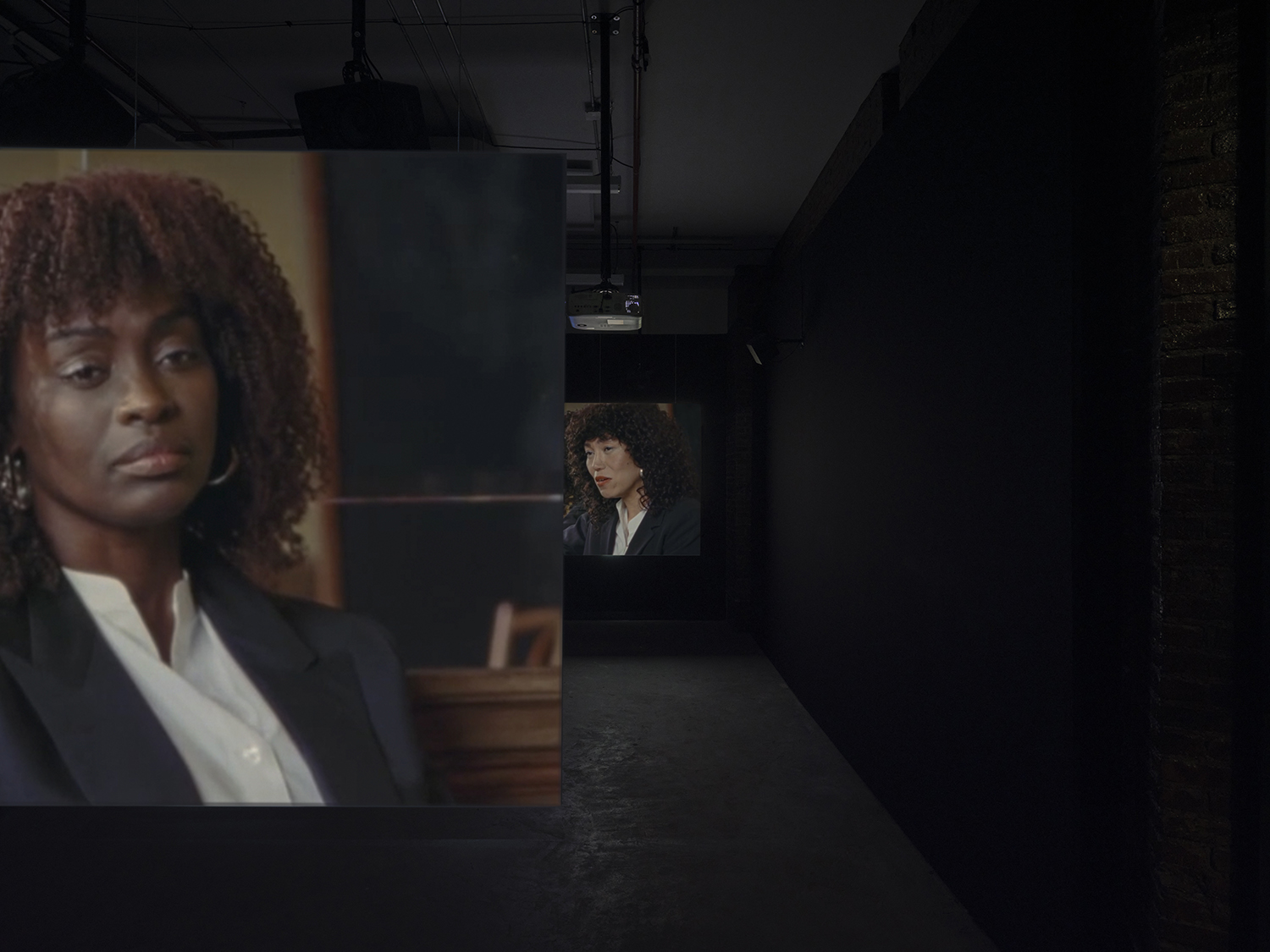 Elisabeth Subrin, *The Listening Takes / Manal Issa, 2024*, 2024, installation view; pictured *The Listening Takes*, 2023-2024, <br>30:00 minutes, 3-channel 16mm/HD video, 9-channel sound, speakers, suspended screens, Photo: Daniel Kukla