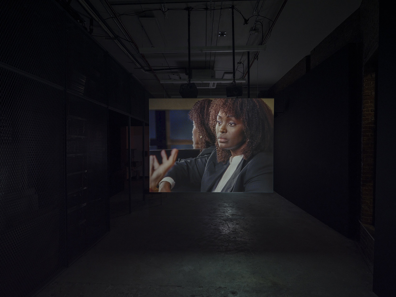 Elisabeth Subrin, *The Listening Takes / Manal Issa, 2024*, 2024, installation view; pictured *The Listening Takes*, 2023-2024, <br>30:00 minutes, 3-channel 16mm/HD video, 9-channel sound, speakers, suspended screens, Photo: Daniel Kukla