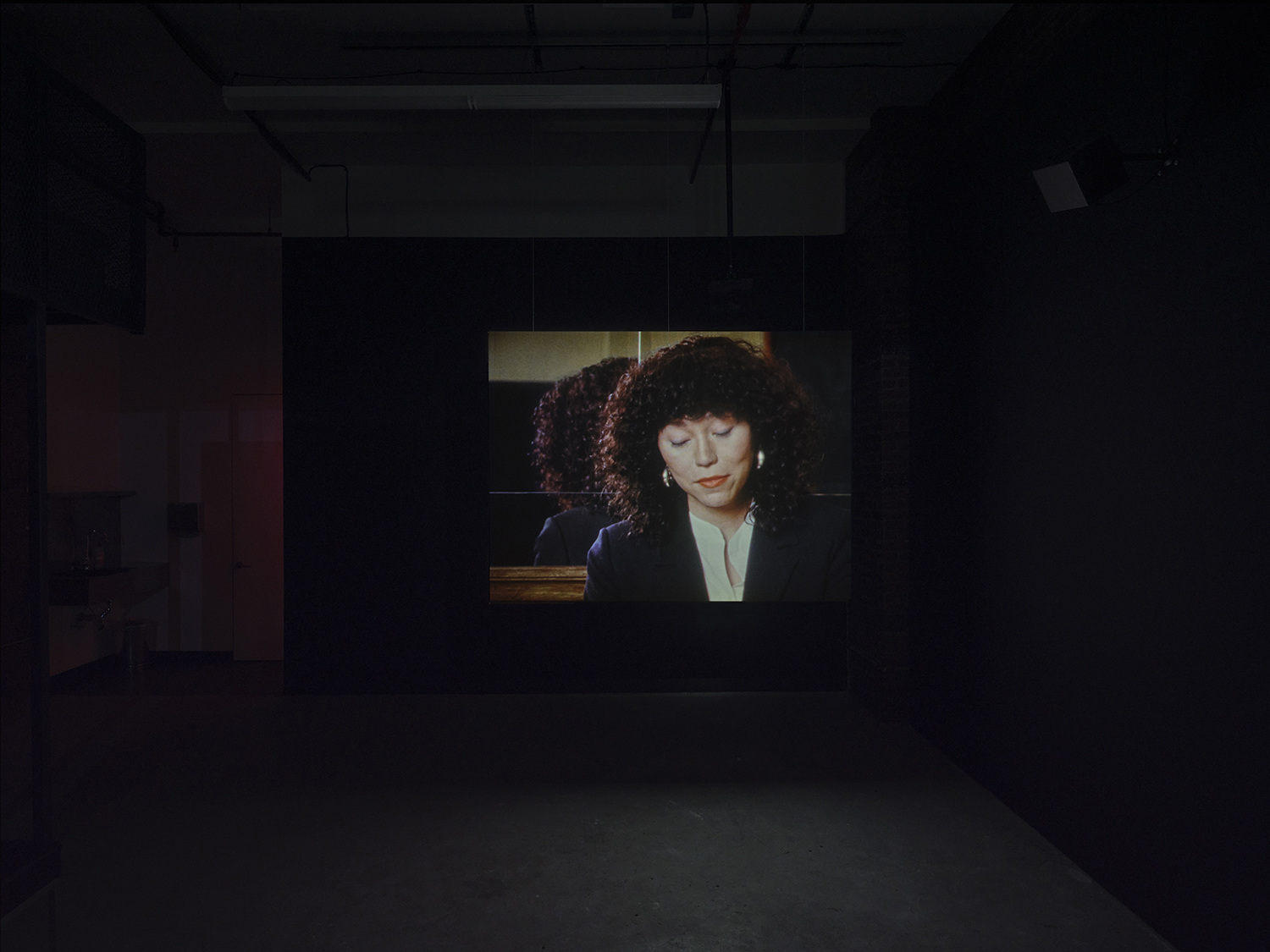 Elisabeth Subrin, *The Listening Takes / Manal Issa, 2024*, 2024, installation view; pictured *The Listening Takes*, 2023-2024, <br>30:00 minutes, 3-channel 16mm/HD video, 9-channel sound, speakers, suspended screens, Photo: Daniel Kukla