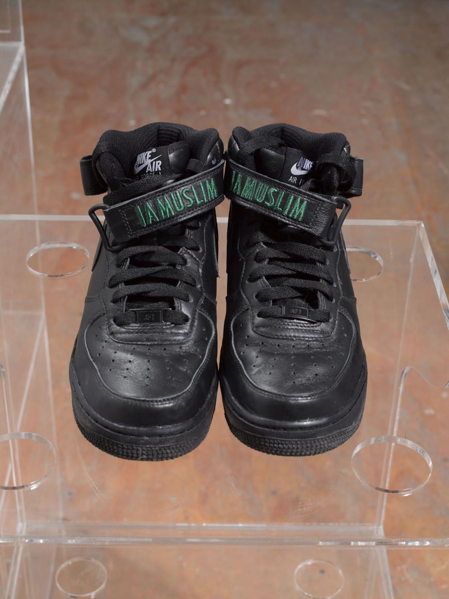 Baseera Khan, *iamuslima*, 2017. Nike ID Tag customized Nike Air Force One Mid top shoes, installation view at Participant Inc, New York. Photo: Thomas Barratt and Mark Waldhauser